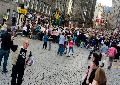 Vendors sell programmes as crowds head up to the castle for the Edinburgh Tattoo