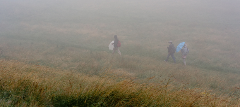 Walkers coming down from Arthur's Seat 250m above sea level on a summer's day in Edinburgh