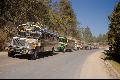 From the Guatemala gallery, vividly repainted US school buses queue on the road to Guatemala City 