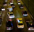 North Circular road, London police car in traffic. Taken from the canal bridge overhead, near Han...