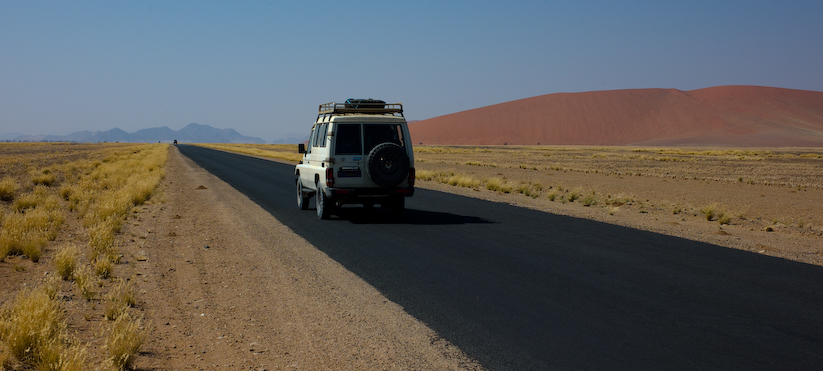 Tourist highway from Sossusvlei to Sesriem, Namibia showing the beautiful combination of pale yel...